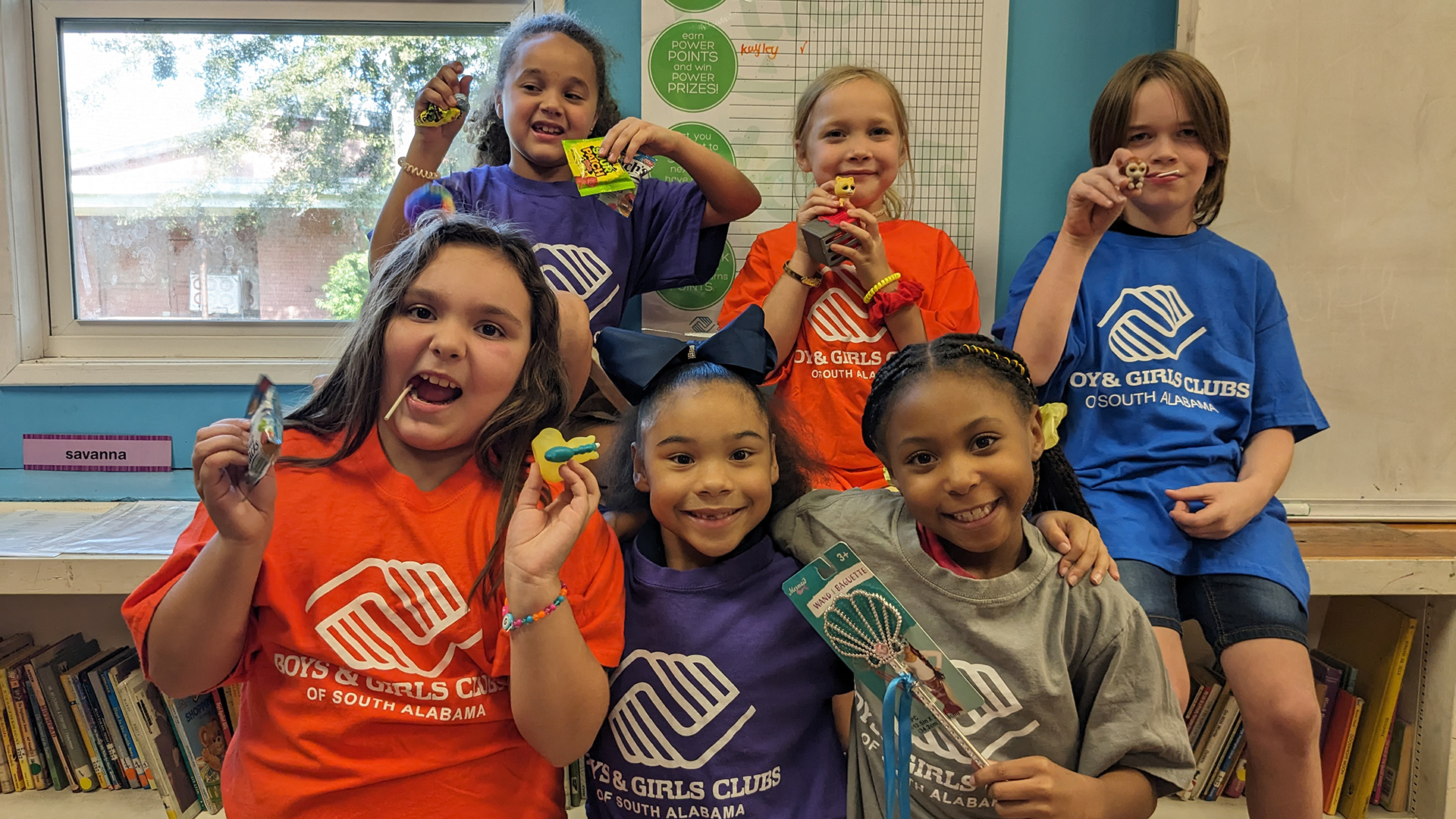 Smiling Club members in colorful Boys & Girls Clubs shirts